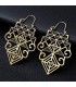 Boucles d'oreilles pendantes en zinc, Triangle de Sri Yantra, géométrie sacrée, Bienfaits énergétiques